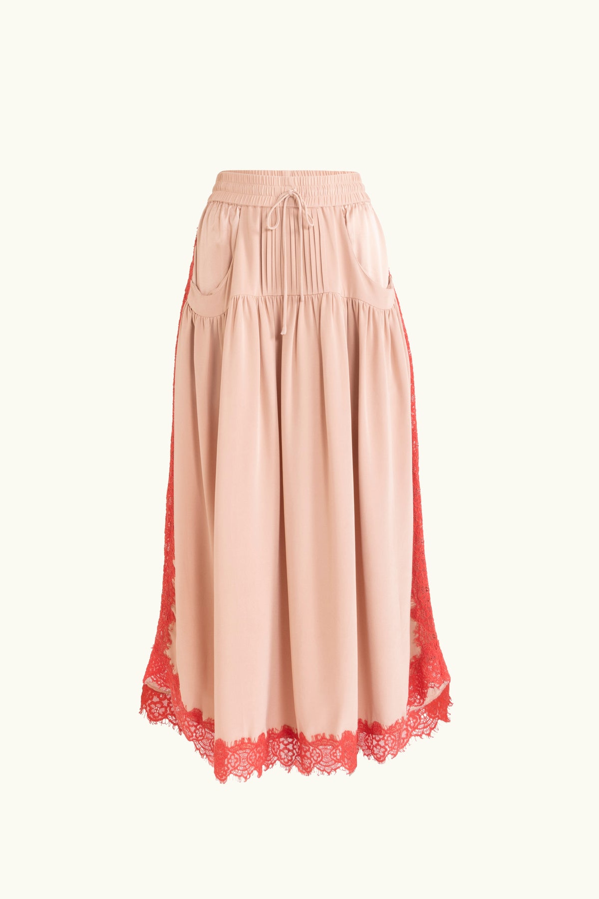 Pink skirt with red lace trim on a white background