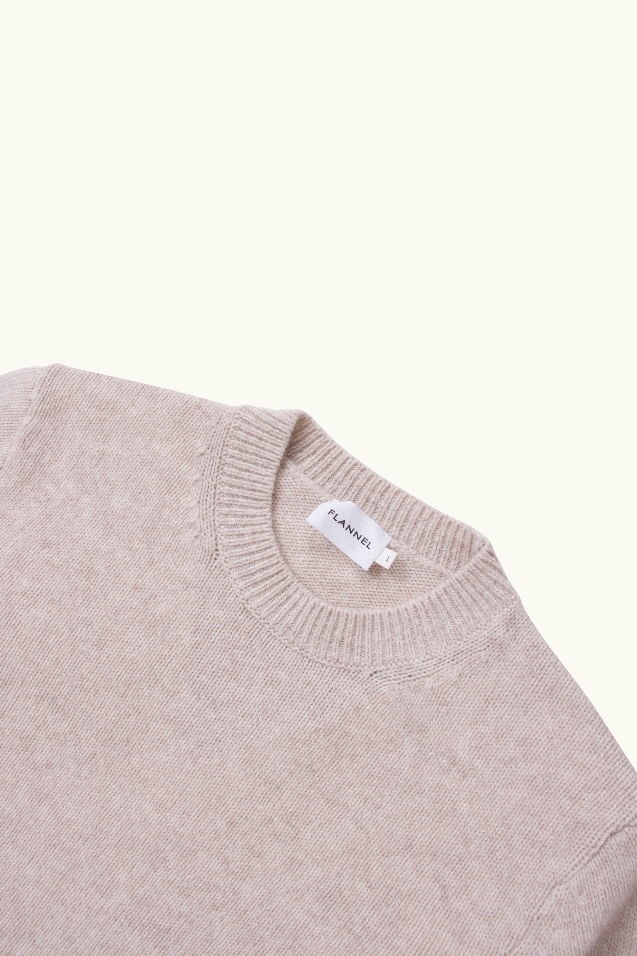 Close up of smoke marle wool cashmere sweater neck on a white background