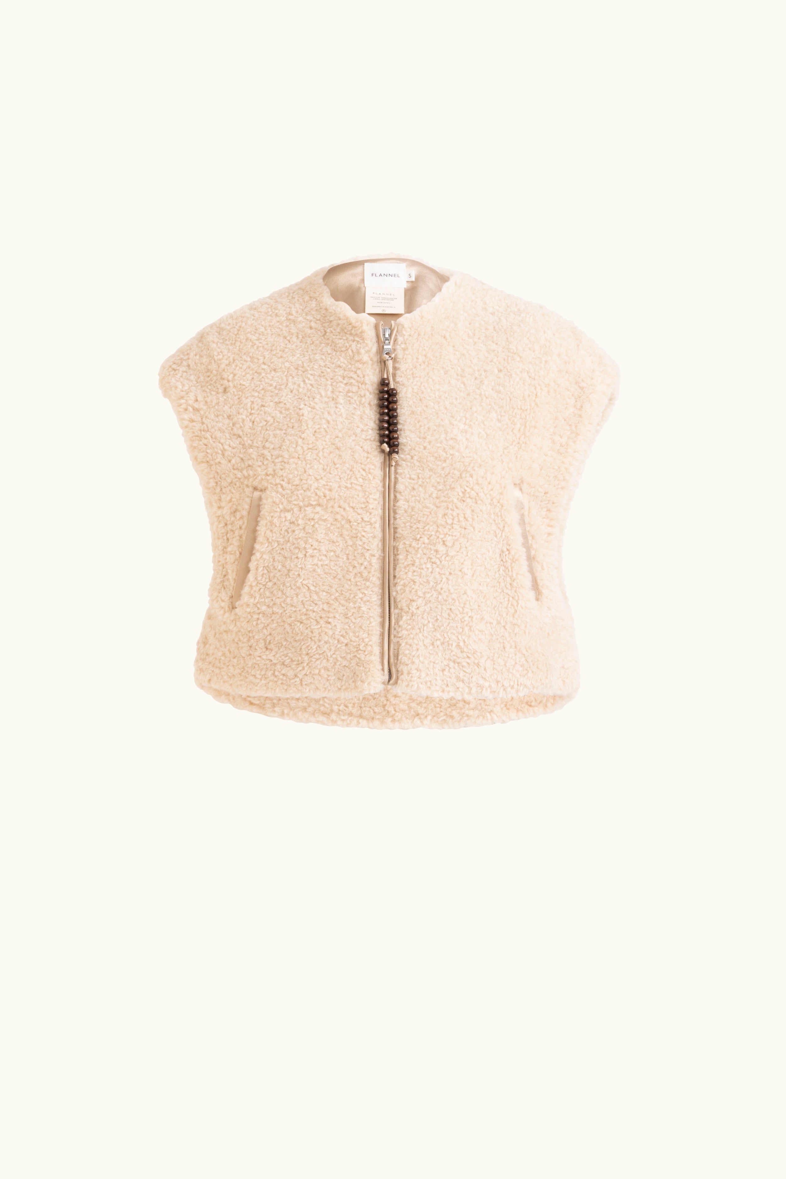 Faux fur oat coloured vest with beaded zip up ties on a white background