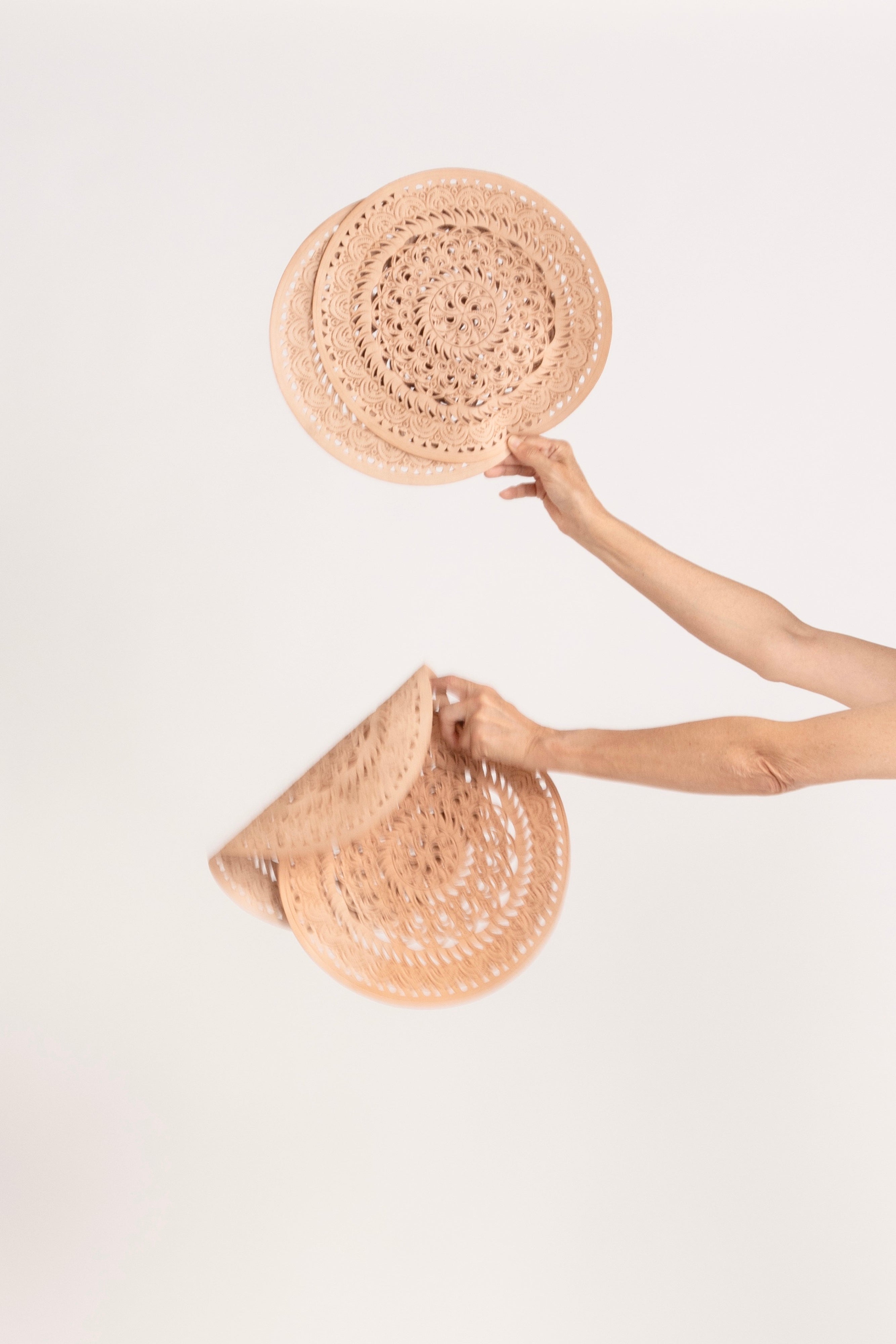 Model holding leather placemats.