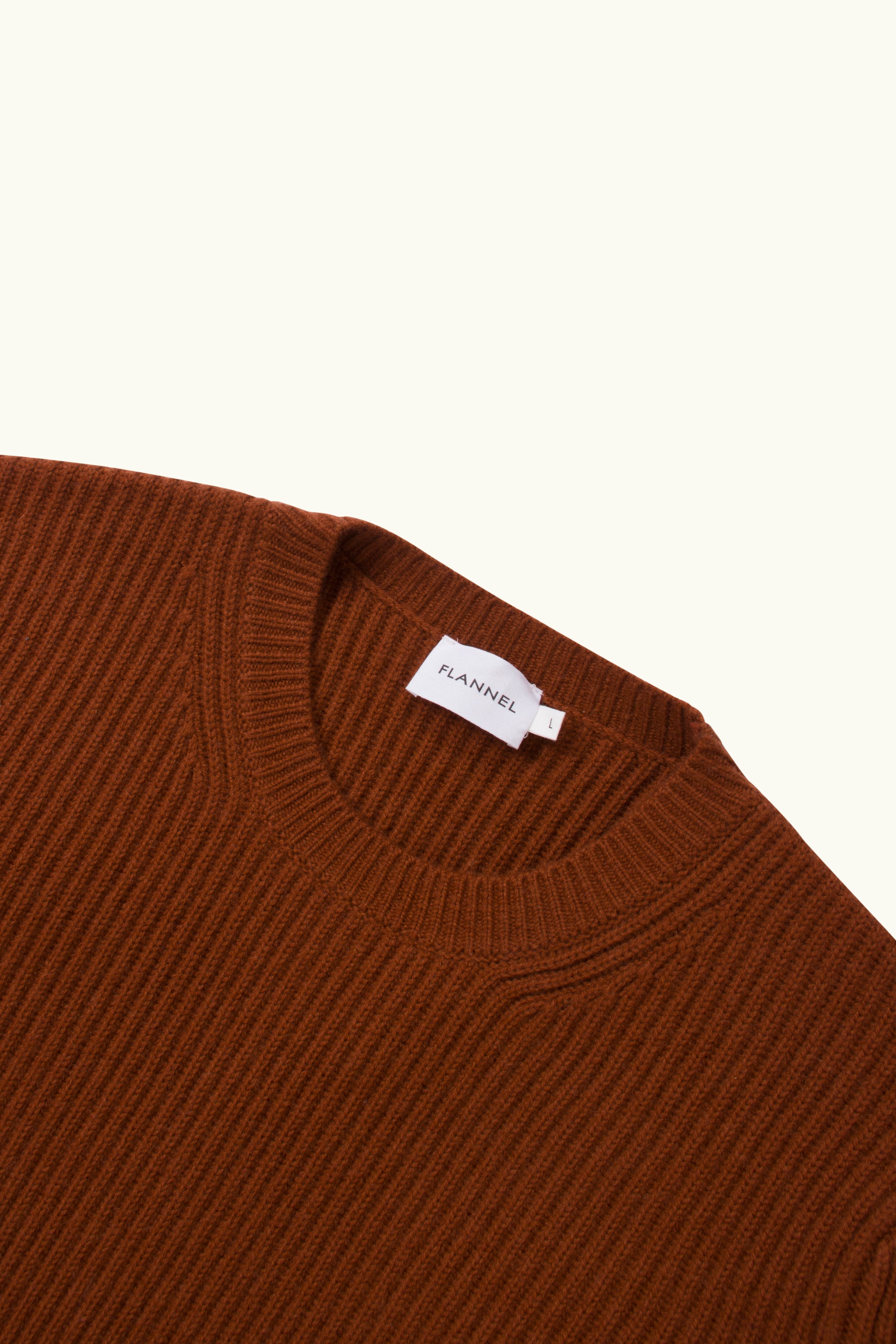 Close up of redclay cashmere wool blend ribbed sweater on a white Background