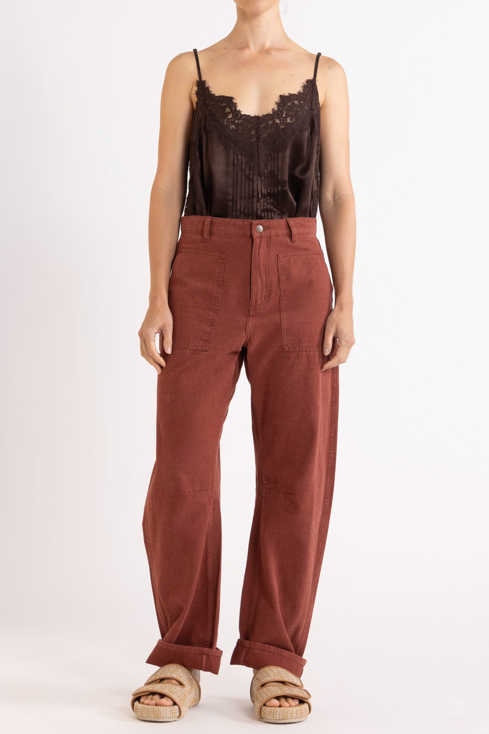 Model wearing chocolate satin cami with lace trims & burgundy cotton-twill pant, front view