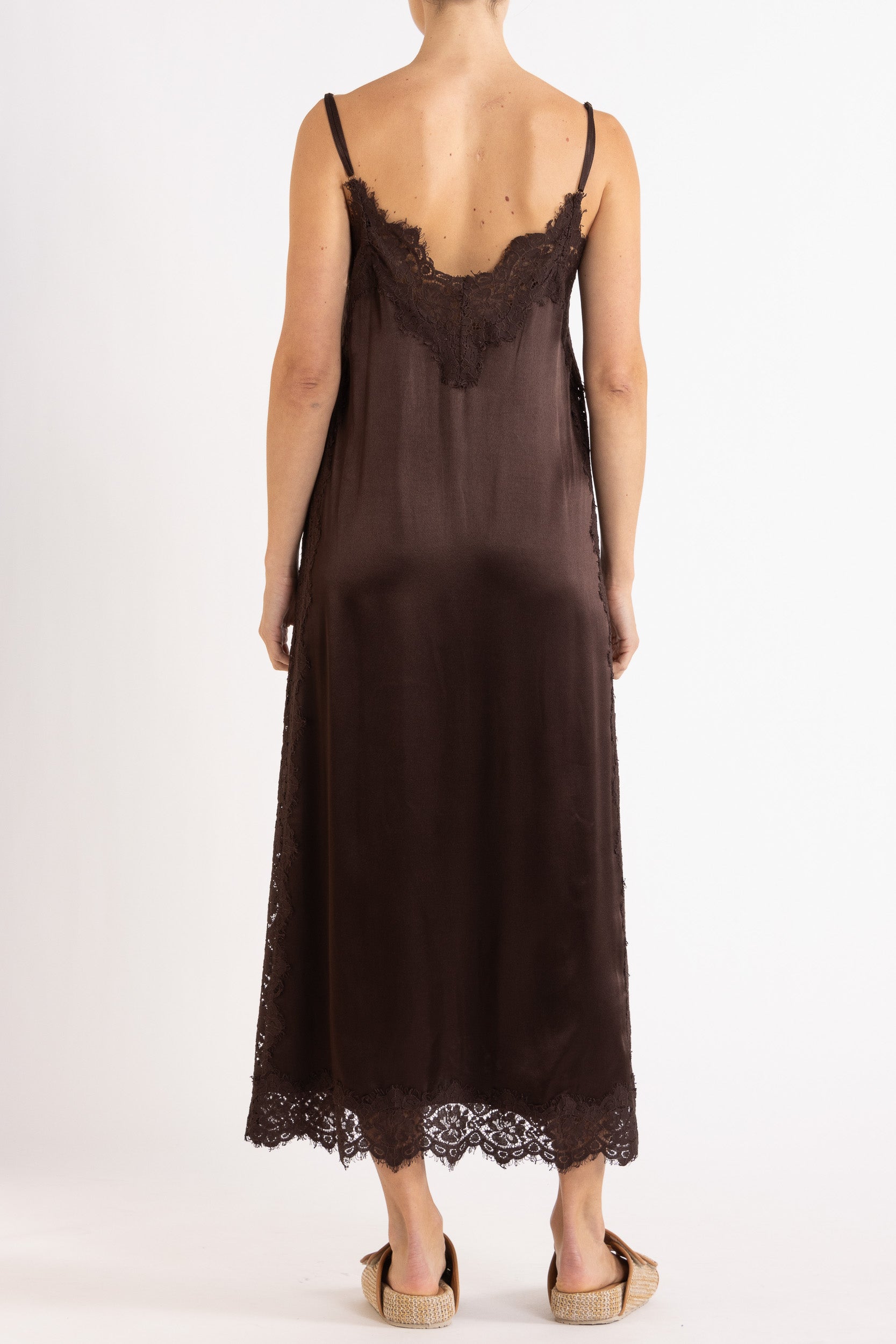 Woman wearing Chocolate lace-trimmed camisole slip dress.