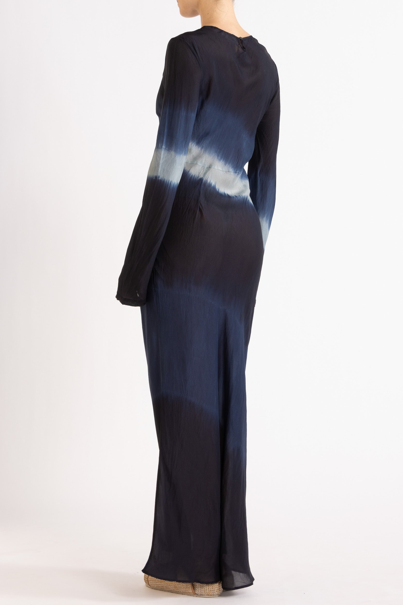 Woman wearing a silk Habotai long Sleeve maxi dress hand tie dyed in ocean tones