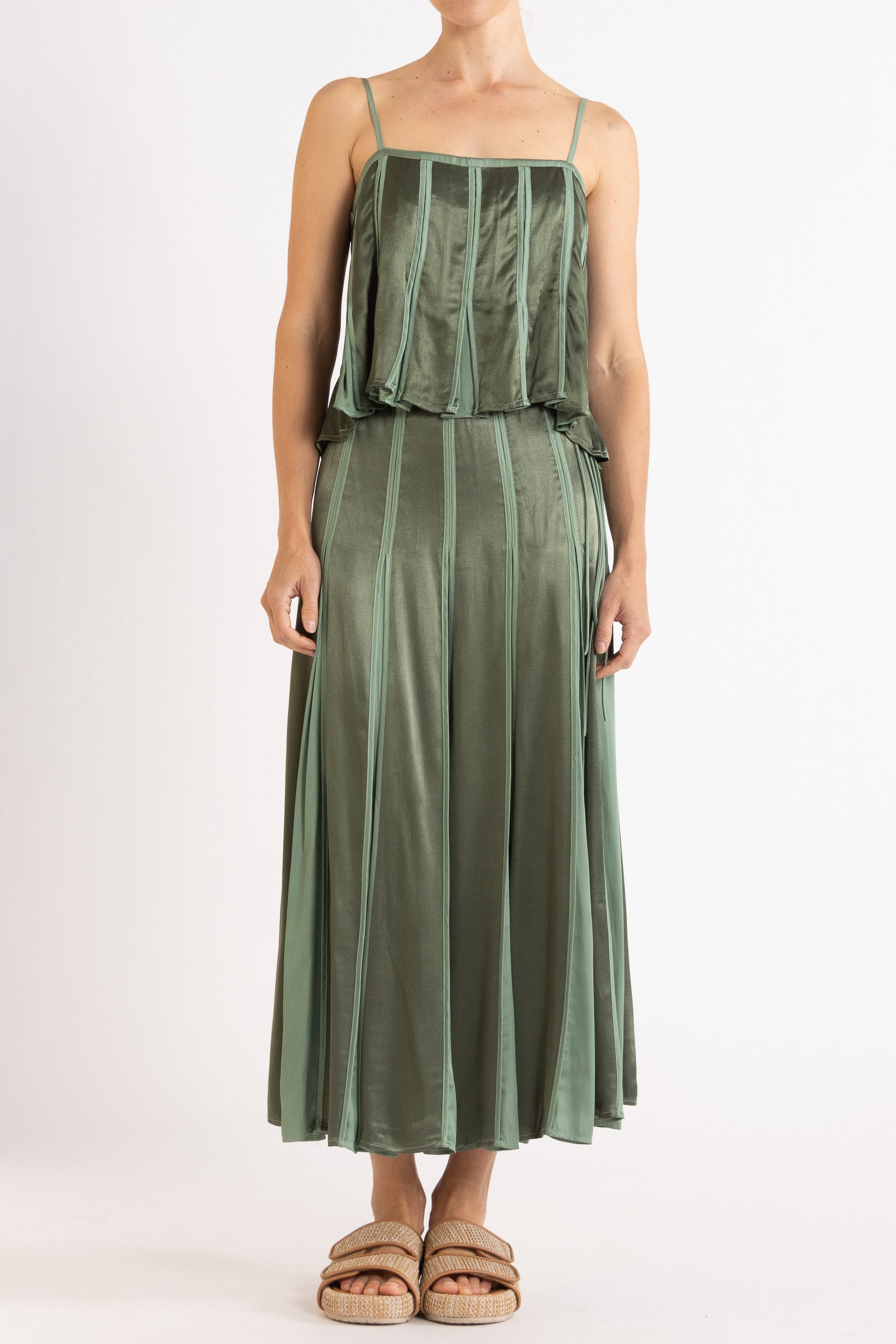 Model wearing cream box pleat camisole & skirt, front view