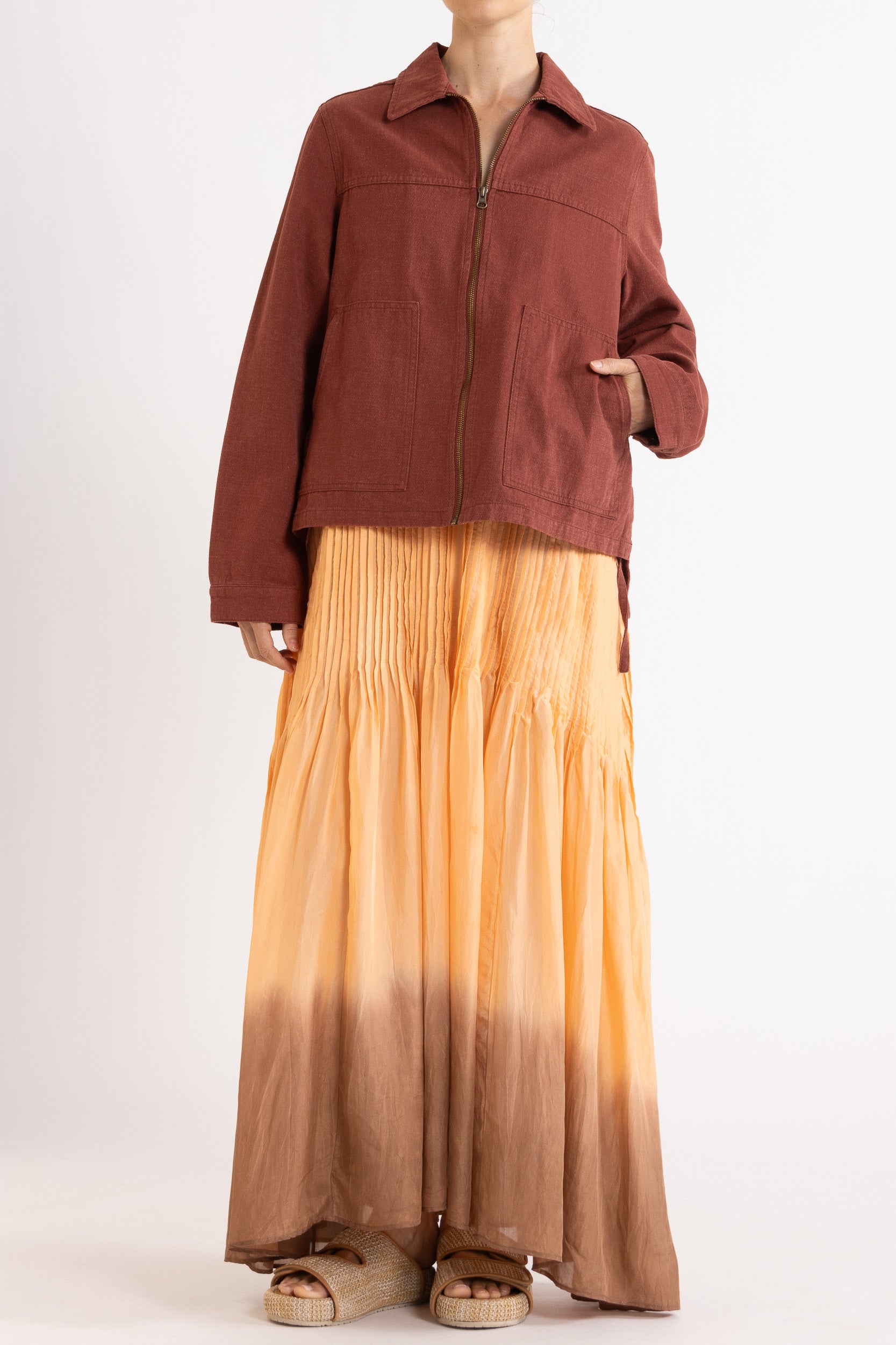 Model wearing burgundy cotton-twill utility jacket & peach dip-dye silk dress, front view