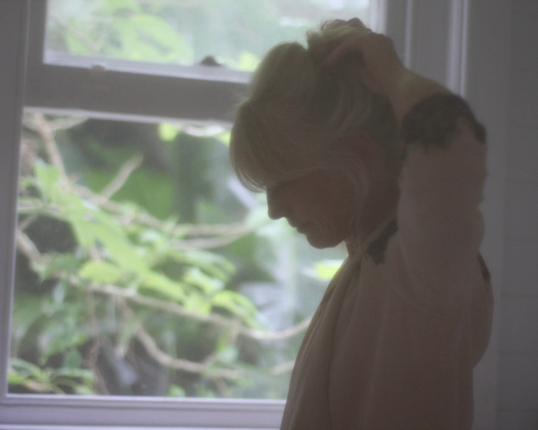 Image of lady wearing flannel shirt. 