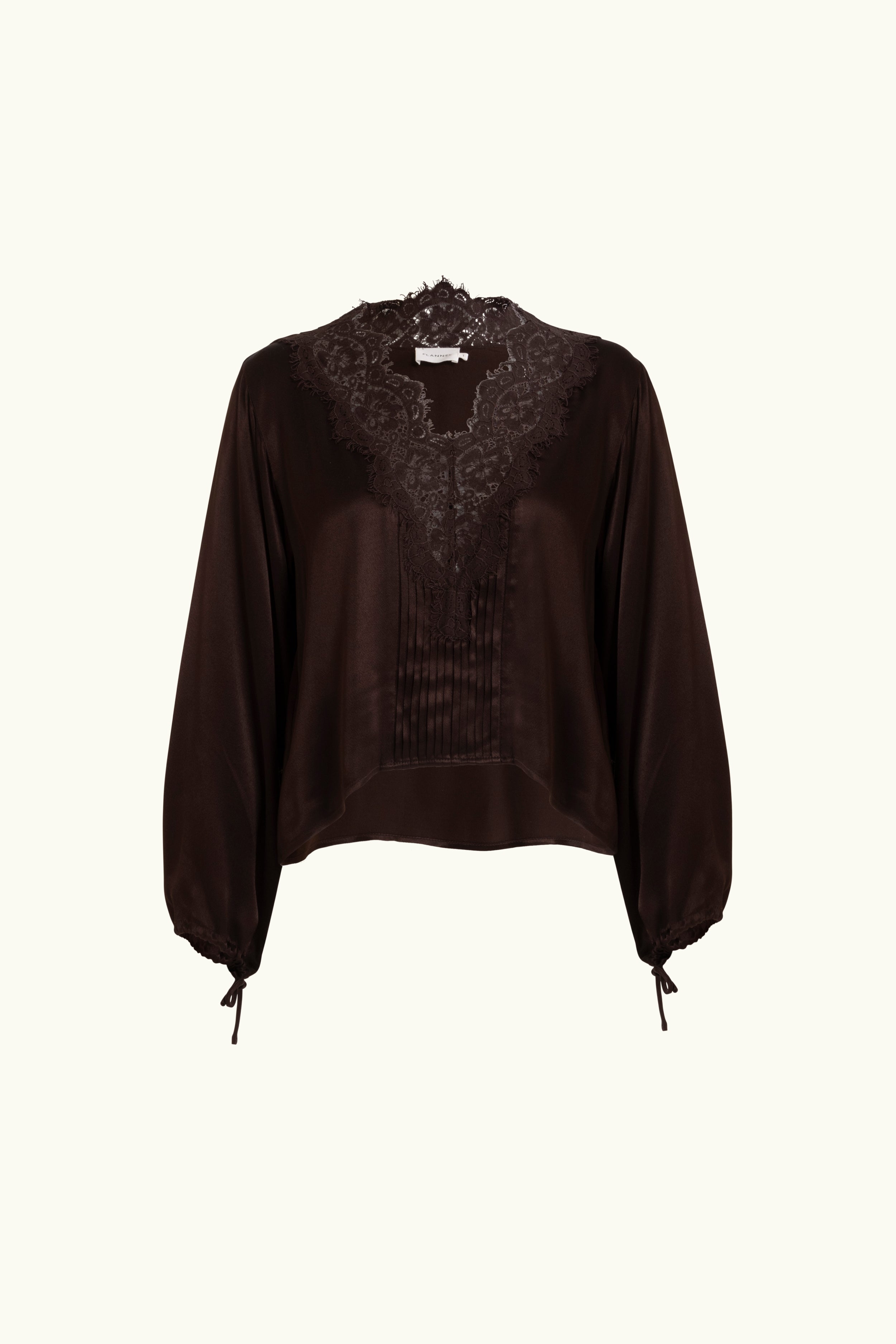 Brown lace-lined long sleeve top on a white background. 