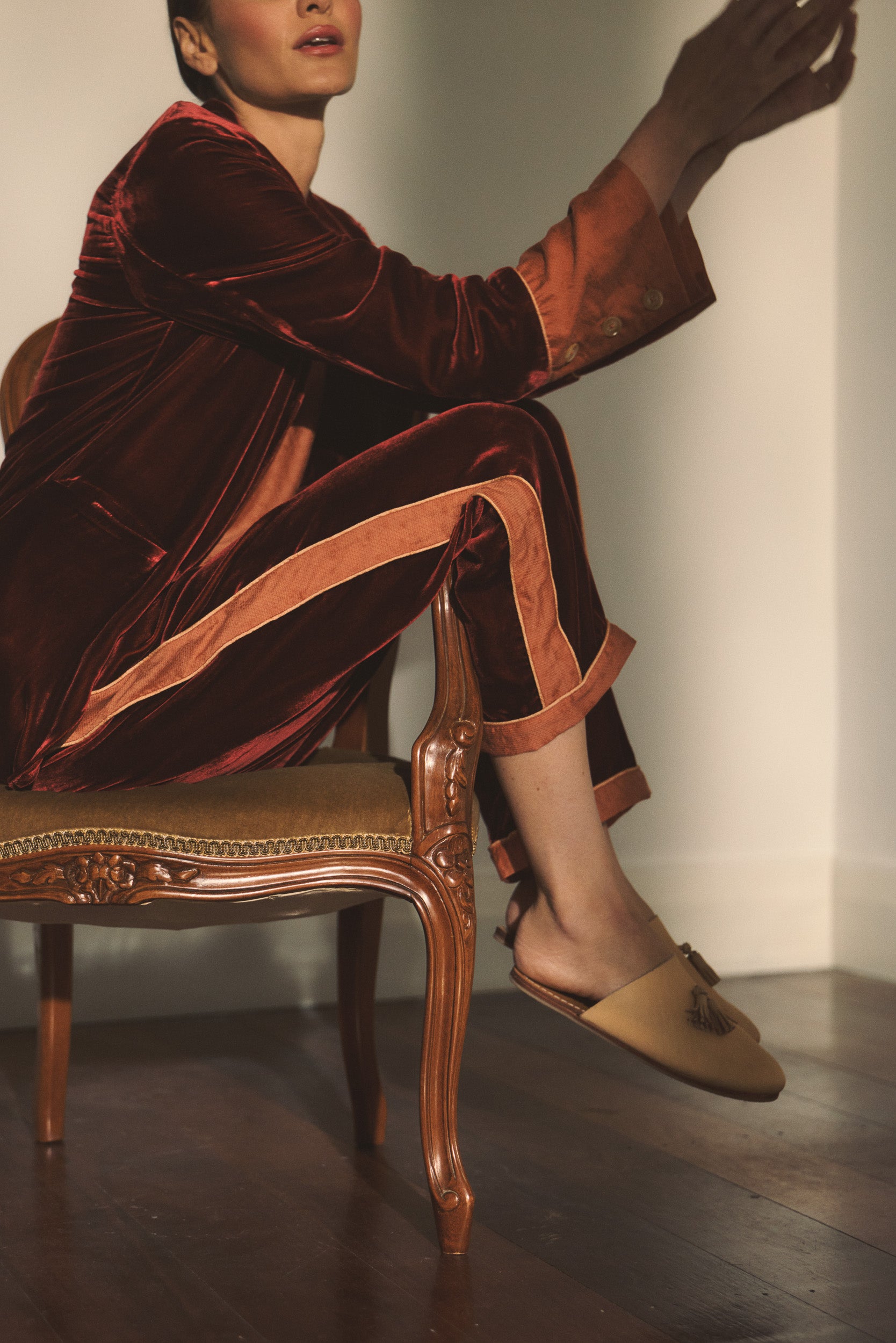 Model wearing port colour velvet suit. 